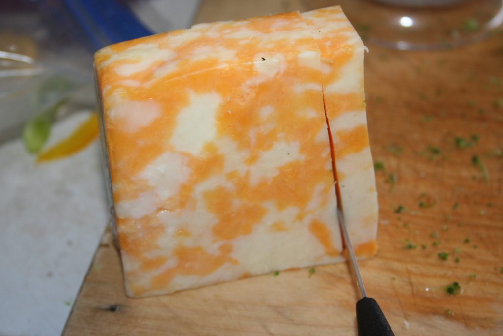 slicing slab of cheese ~ Lifeofjoy.me